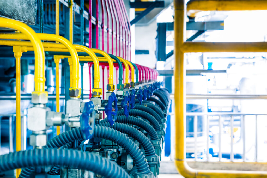 steel pipelines and cables in a plant,Industrial zone.